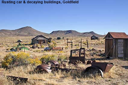  Rusting car & decaying buildings, Goldfield, NV, USA